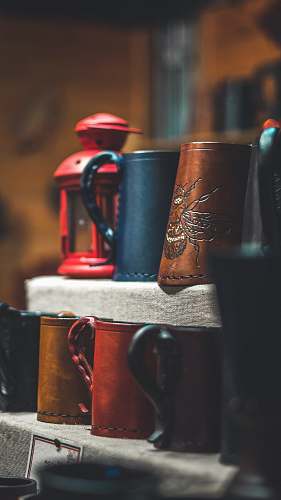 cup brown and black mugs on rack manchester